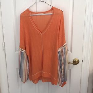 Orange sweater with gathered bell sleeve